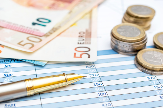 Euro Bills Coins With Pen Financial Graphs Business Concept
