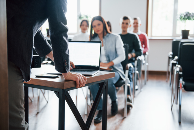 Using Laptop Group People Business Conference Modern Classroom Daytime