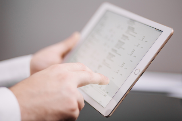 Unrecognizable Office Worker With Tablet