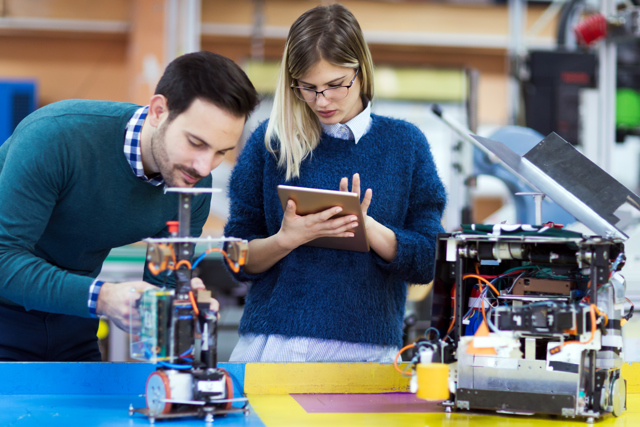 Young Students Robotics Working Project Together