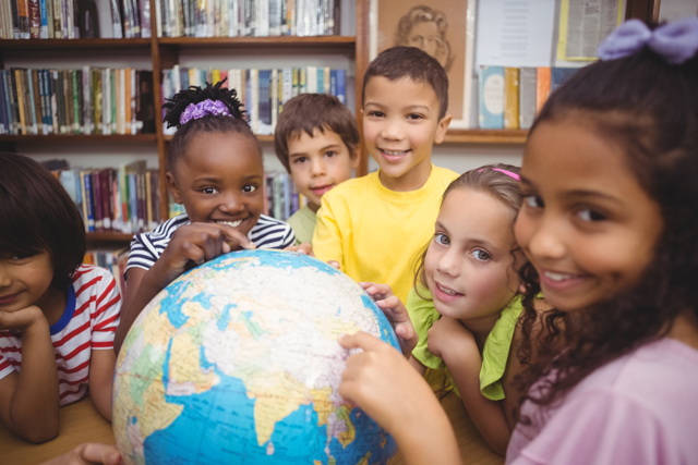 Pupils Looking Globe Library